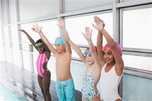 Children On The Pool Deck Learning How To Dive