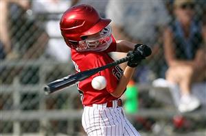 Baseball player hitting the ball