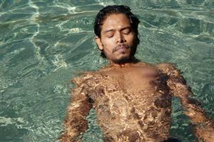 Adult Man Doing A Back Float