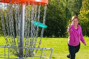Woman about to score in ultimate frisbee